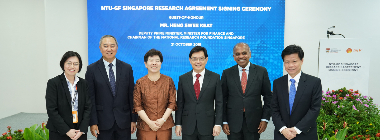 Six people in formal wear posing at the NTU-GF Singapore Research Agreement Signing Ceremony.